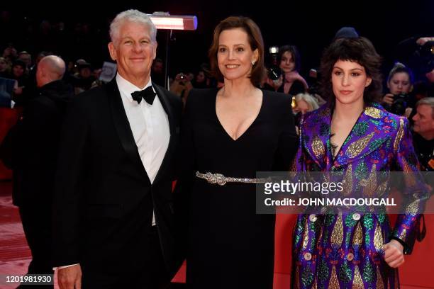 Actress Sigourney Weaver poses with her husband Jim Simpson and their daughter Charlotte Simpson on the red carpet before the opening ceremony of the...