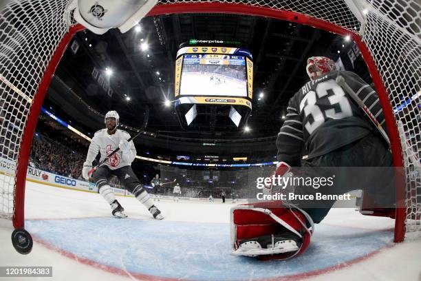 Goaltender David Rittich of the Calgary Flames gives up a goal to Anthony Duclair of the Ottawa Senators in the game between Atlantic Division v...