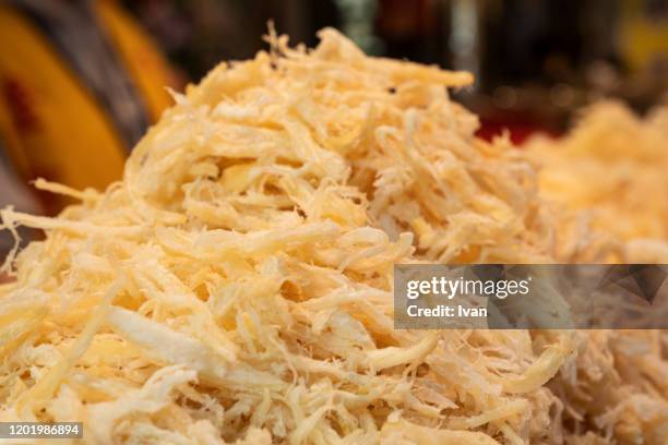 dried shredded squid in the market - em tiras imagens e fotografias de stock