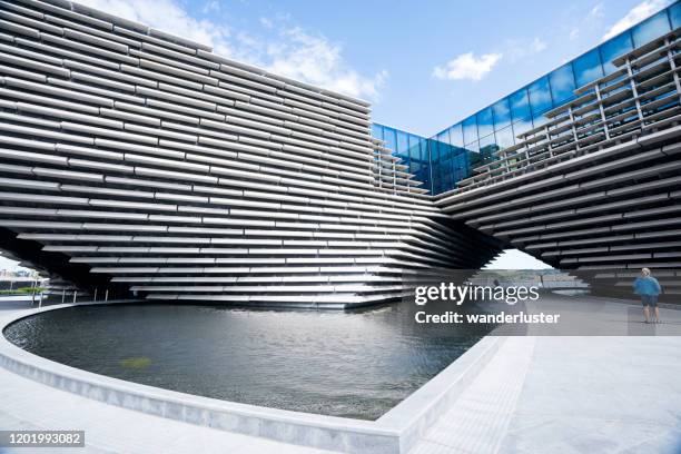 tourist visiting v&a dundee - dundee scotland stock pictures, royalty-free photos & images