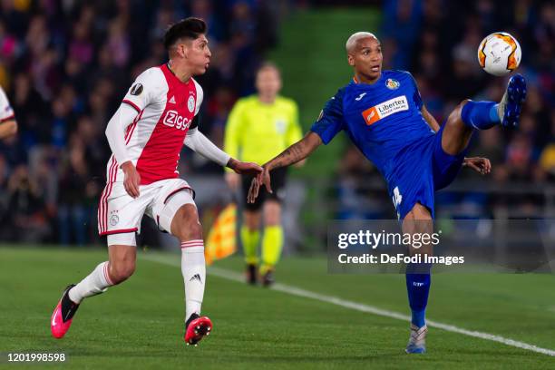 Edson Alvarez of AFC Ajax and Deyverson Silva of Getafe CF battle for the ball during the UEFA Europa League Round of 32 first leg match between...