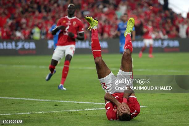 Ahly's forward Mahmoud Kahraba reacts on the pitch during the Egyptian Super Cup final football match between Ahly SC and Zamalek SC at Mohammed Bin...