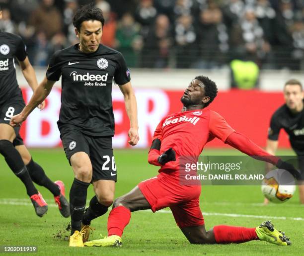 Frankfurt's Japanese midfielder Makoto Hasebe and Salzburg's Malian forward Sekou Koita vie for the ball during the Europa League last 32 first leg...