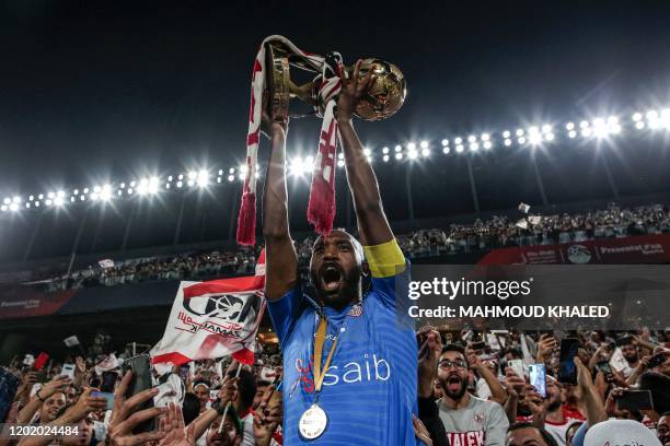 Zamalek SC's captain Mahmoud Abdel Razek 'Shikabala' celebrates with the Egyptian Super Cup trophy after his team won the final match against Ahly SC...