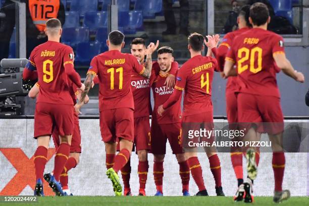 As Roma's Spanish forward Carles Peres celebrates after scoring a goal during the UEFA Europa League round of 32 first leg football match between AS...