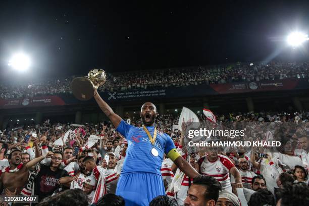 Zamalek SC's captain Mahmoud Abdel Razek 'Shikabala' celebrates with the Egyptian Super Cup trophy after his team won the final match against Ahly SC...