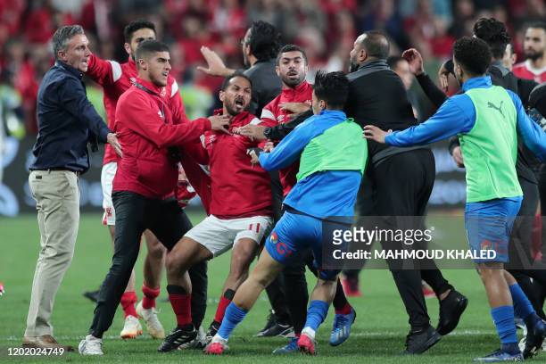Ahly SC's players scuffle with Zamalek SC's players after the Egyptian Super Cup final football match between Ahly SC and Zamalek SC at Mohammed Bin...