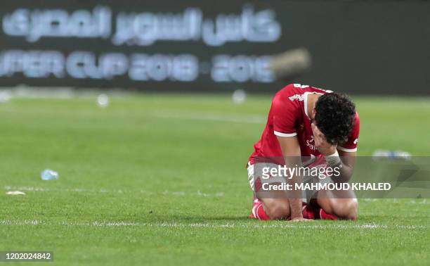 Ahly's defender Mohamed Hani reacts after the Egyptian Super Cup final football match between Ahly SC and Zamalek SC at Mohammed Bin Zayed stadium in...