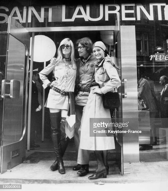 French fashion designer Yves Saint Laurent posing in front of his new shop in Bond Street on September 10, 1969 in London, United Kingdom. He is with...
