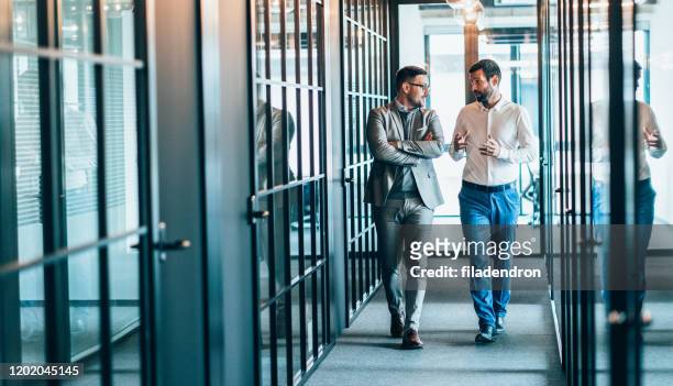 business partners in discussion - partnership stock pictures, royalty-free photos & images