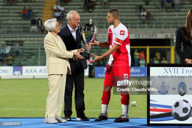 Atalanta President Antonio Percassi give the trophy to Adel Taarabt of Queen Park Rangers after winning the Bortolotti Trophy at Stadio Atleti...