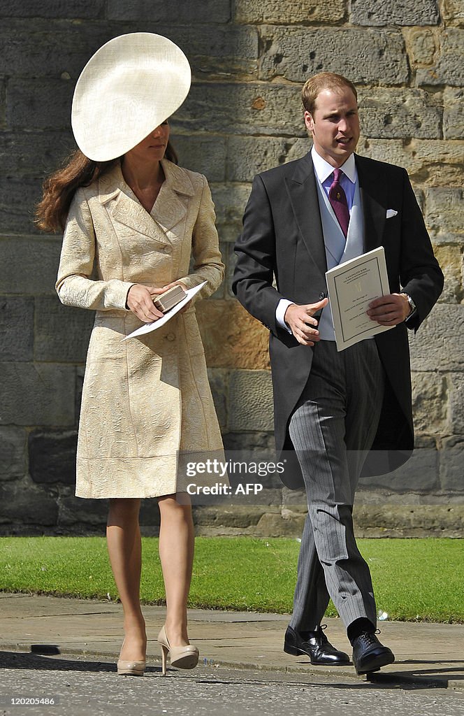 Britain's Prince William (R) and his wif