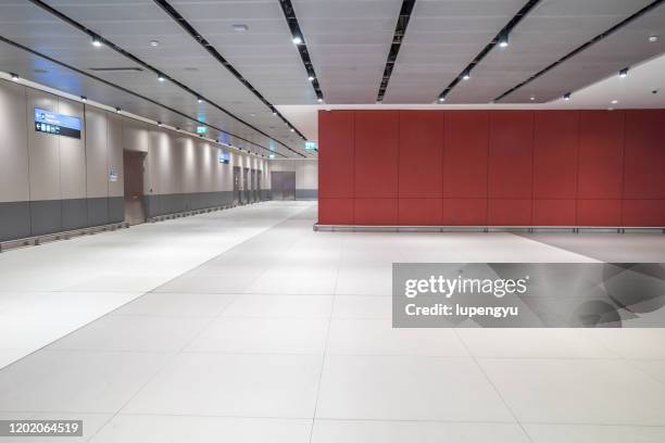 empty room in airport - airport wall stock pictures, royalty-free photos & images