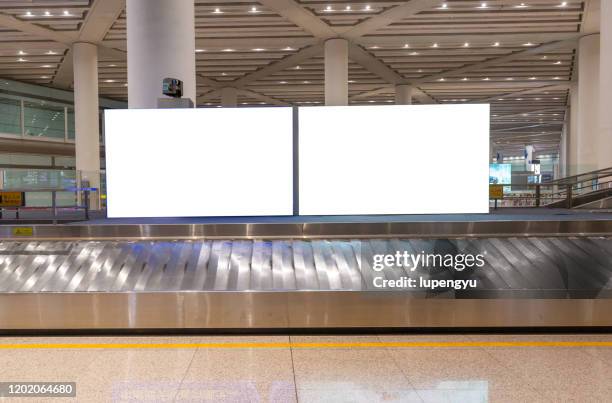 billboard at baggage claim - airport advertising stock pictures, royalty-free photos & images