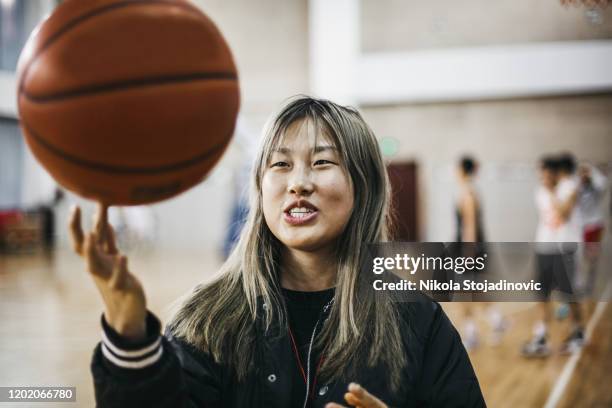 young chinese woman basketball player - roll up stock pictures, royalty-free photos & images