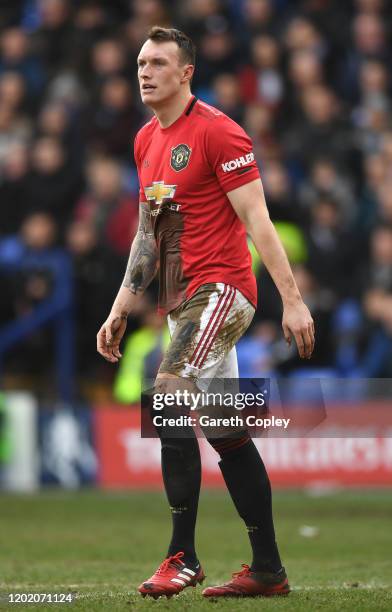 Phil Jones of Manchester United covered in mud during the FA Cup Fourth Round match between Tranmere Rovers and Manchester United at Prenton Park on...