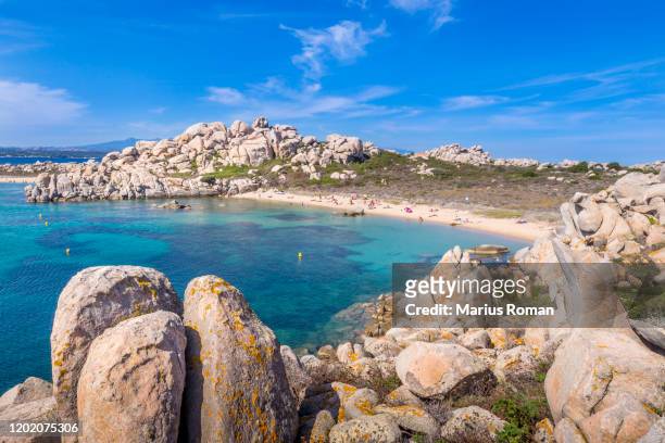 scenic view of the island of lavezzi with turquoise sea, beach and amazing granite boulders,strait of bonifacio, corse-du-sud, corsica, france, europe. - bonifacio stock pictures, royalty-free photos & images