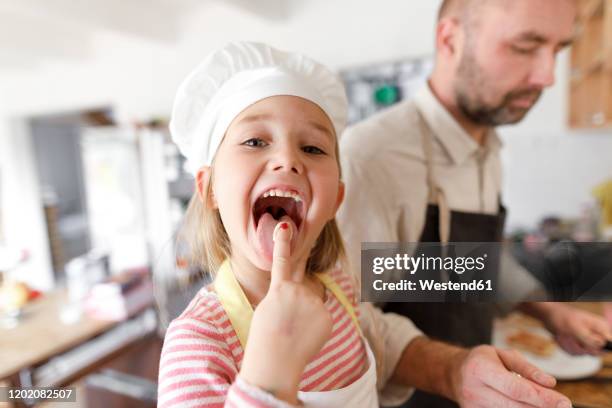 father and daughter cooking in the kitchen - tasting cooking stock pictures, royalty-free photos & images