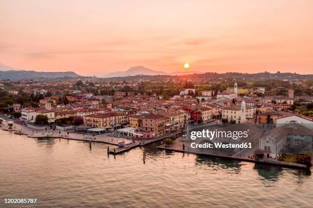 italy, veneto, lazise at lake garda, drone view at sunrise - verona italy stock pictures, royalty-free photos & images