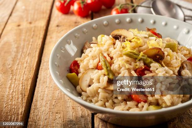 close-up of bowl of risotto with mushrooms - risotto stock pictures, royalty-free photos & images