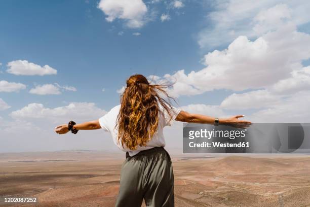 back view of redheaded woman enjoying view, fez, morocco - moroccan woman stock pictures, royalty-free photos & images