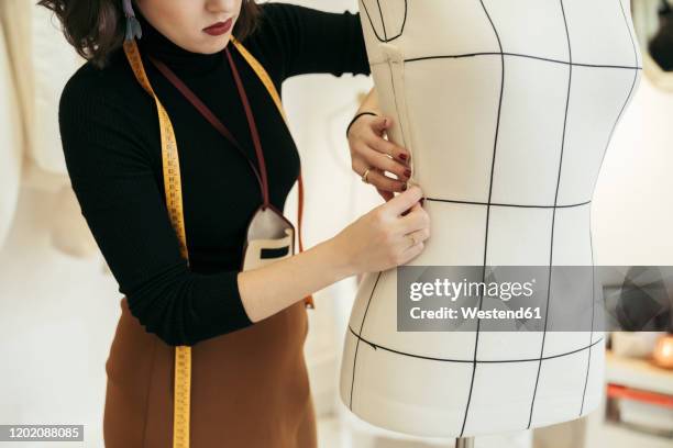 crop view of fashion designer at work - instrument of measurement stock pictures, royalty-free photos & images