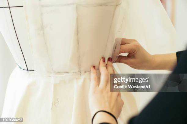 fashion designer's hands at work - atelier fashion stock pictures, royalty-free photos & images