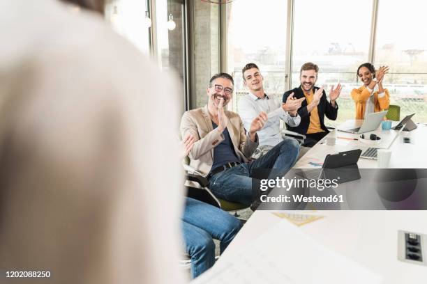 happy business people applauding during a meeting in boardroom - the end imagens e fotografias de stock