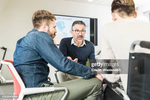 three businessmen having a meeting in office - startup founder stock pictures, royalty-free photos & images