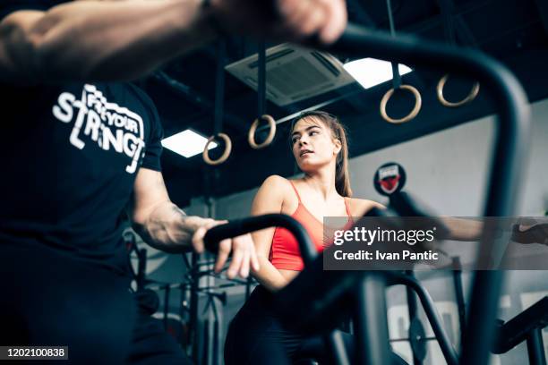 young couple in a gym - flirting gym stock pictures, royalty-free photos & images