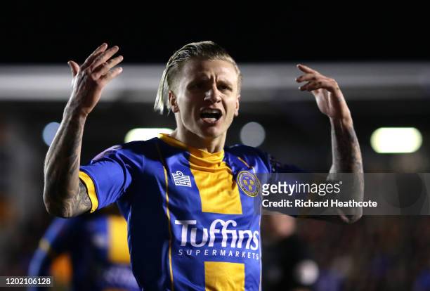 Jason Cummings of Shrewsbury Town celebrates after scoring his team's first goal during the FA Cup Fourth Round match between Shrewsbury Town and...