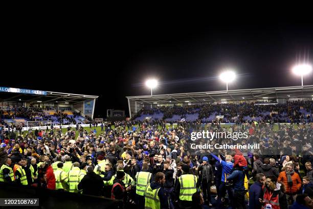 General view as Shrewsbury fans invade the pitch during the FA Cup Fourth Round match between Shrewsbury Town and Liverpool at New Meadow on January...