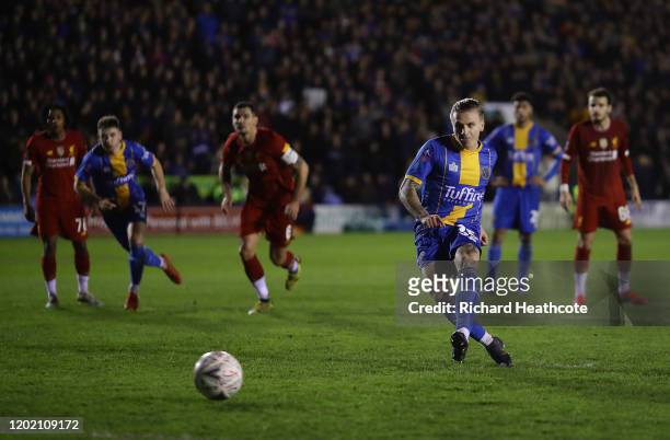 Jason Cummings of Shrewsbury scores the first goal from the penalty spot during the FA Cup Fourth Round match between Shrewsbury Town and Liverpool...
