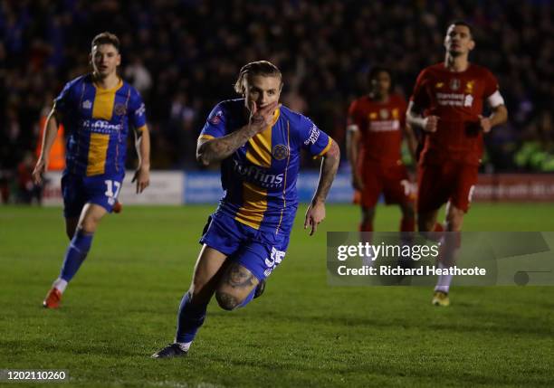Jason Cummings of Shrewsbury celebrates scoring the first goal from the penalty spot during the FA Cup Fourth Round match between Shrewsbury Town and...