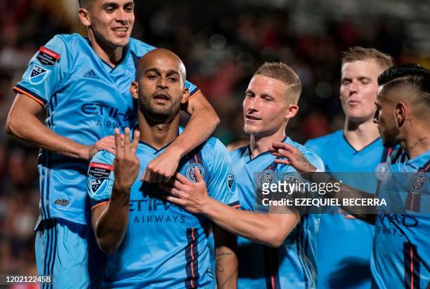 S New York City FC Brazilian player Heber Araujo celebrates with teammates his goal against Costa Rica's San Carlos during their CONCACAF Champions...