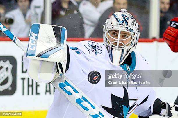 San Jose Sharks goaltender Martin Jones makes a save during the second period of the National Hockey League game between the New Jersey Devils and...