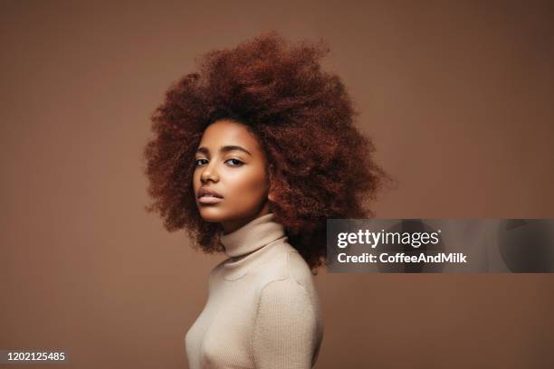 photo of cheerful curly girl with positive emotions - curly girl stock pictures, royalty-free photos & images