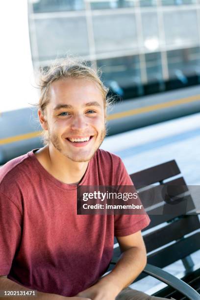 portrait of 19 years old smiling young man, background with copy space - handsome teen boy outdoors stock pictures, royalty-free photos & images