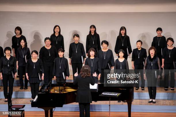 women singing at chorus concert - choir stage stock pictures, royalty-free photos & images
