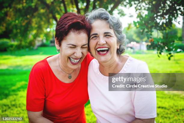 two senior women together - senior colored hair stock pictures, royalty-free photos & images