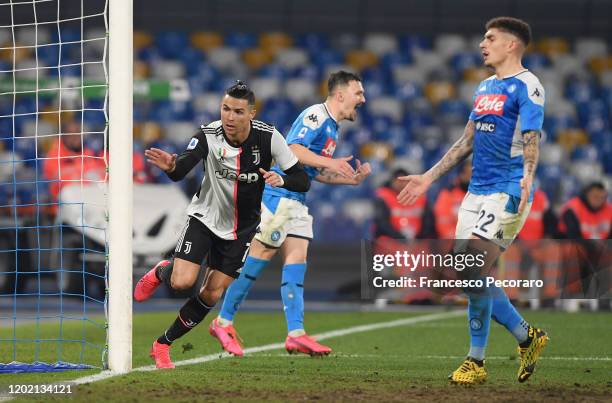 Cristiano Ronaldo of Juventus scores the 2-1 goal as Mario Rui and Giovanni Di Lorenzo of SSC Napoli react during the Serie A match between SSC...