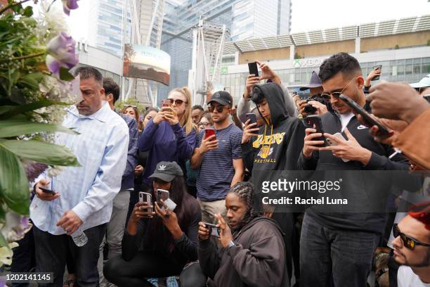 Los Angeles Lakers fans mourn the death of retired NBA star Kobe Bryant outside the Staples Center prior to the 62nd Annual Grammy Awards on January...
