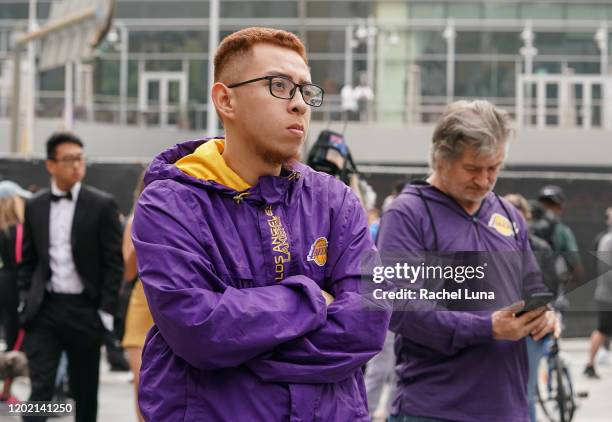 Los Angeles Lakers fans mourn the death of retired NBA star Kobe Bryant outside the Staples Center prior to the 62nd Annual Grammy Awards on January...