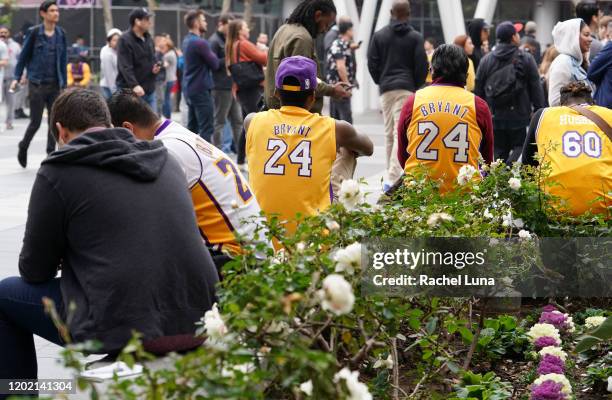 Los Angeles Lakers fans mourn the death of retired NBA star Kobe Bryant outside the Staples Center prior to the 62nd Annual Grammy Awards on January...