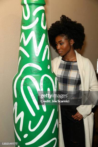 Jayme Lawson of "Farewell Amor" signs the Heineken bottle sculpture at TheWrap Studio at Sundance Film Festival on January 26, 2020 in Park City,...