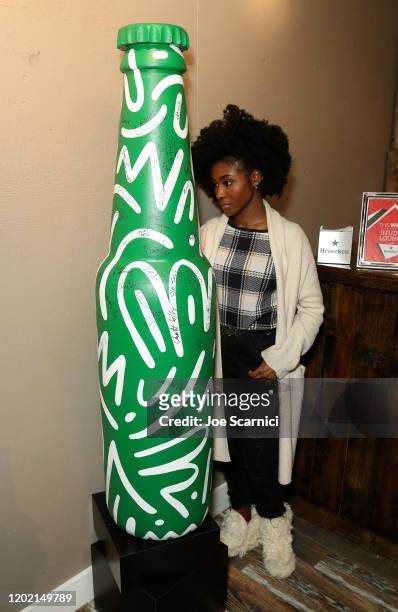 Jayme Lawson of "Farewell Amor" signs the Heineken bottle sculpture at TheWrap Studio at Sundance Film Festival on January 26, 2020 in Park City,...