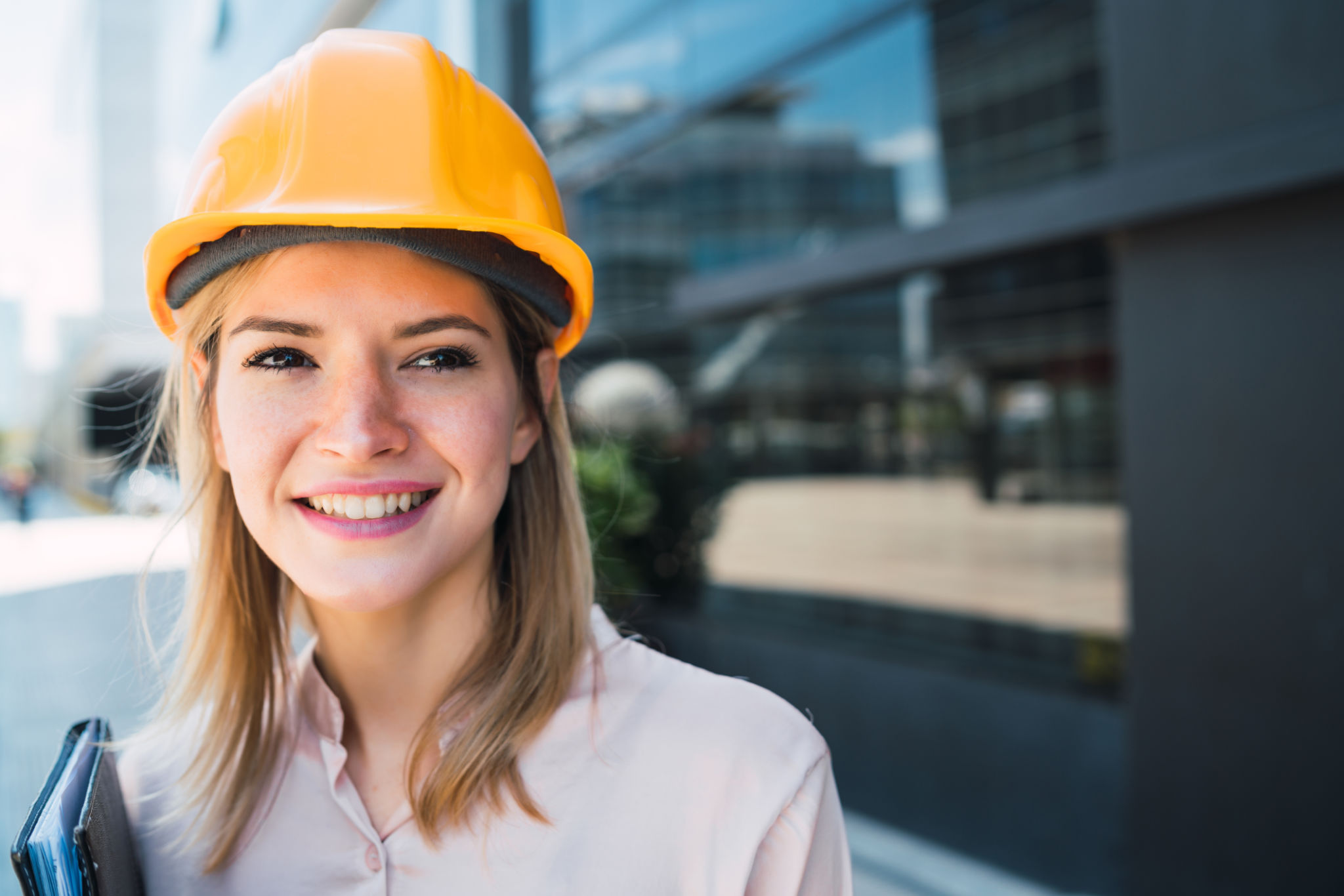 Professional architect woman standing outdoors. Professional architect woman standing outdoors.
