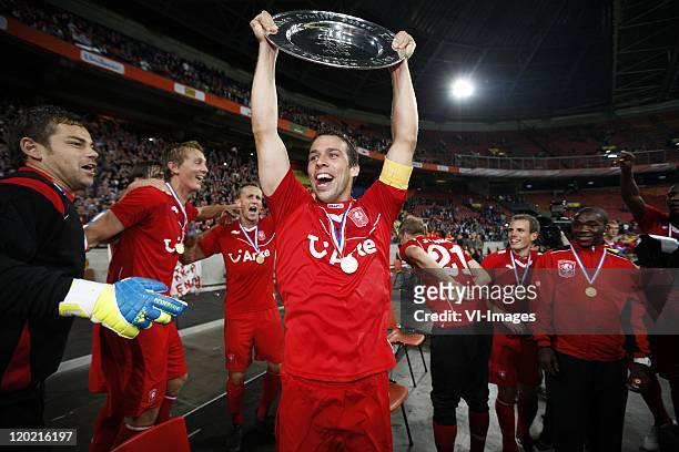 Peter Wisgerhof of FC Twente holding the trophy after the Johan Cruyff Shield match between Ajax and FC Twente at the Amsterdam Arena on July 30,...
