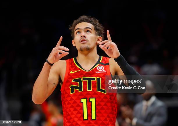 Trae Young of the Atlanta Hawks reacts after hitting a three-point basket against the Washington Wizards in the second half at State Farm Arena on...