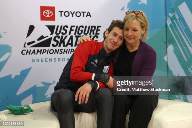 Jason Brown reacts with his coach Tracy Wilson to his scores after skating in the Men's Free Skate during the 2020 U.S. Figure Skating Championships...
